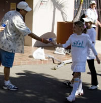 Steve Heimberg hands out water at 5K/10K Walk-FUN-Run